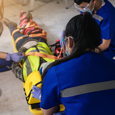 Patient with a spinal injury being immobilized.